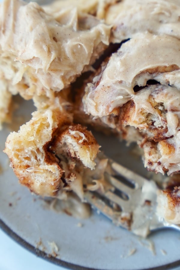 a forkful of the best sourdough cinnamon rolls