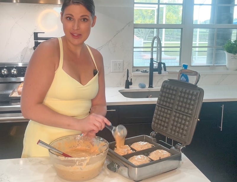 pouring waffle batter in the waffle maker