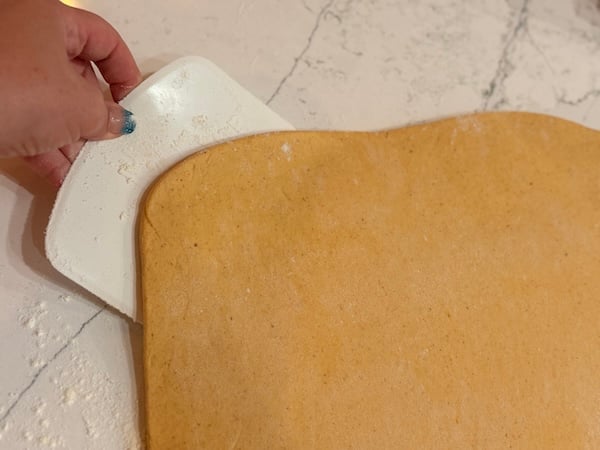 push dough scraper underneath