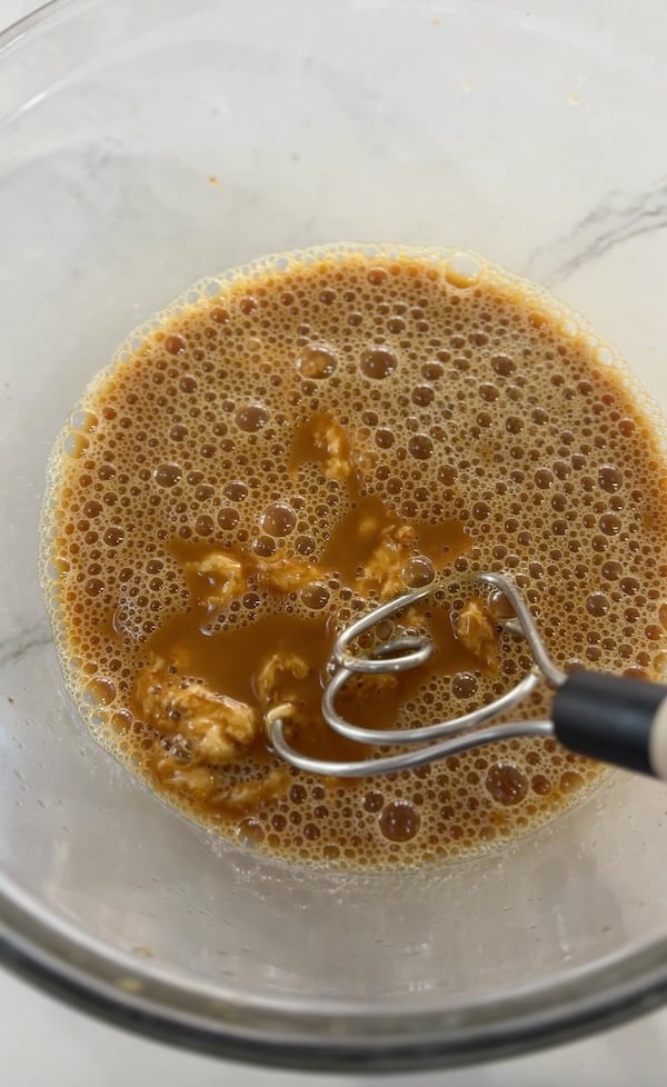 stirring starter and liquids together