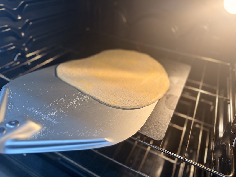 transferring pizza dough