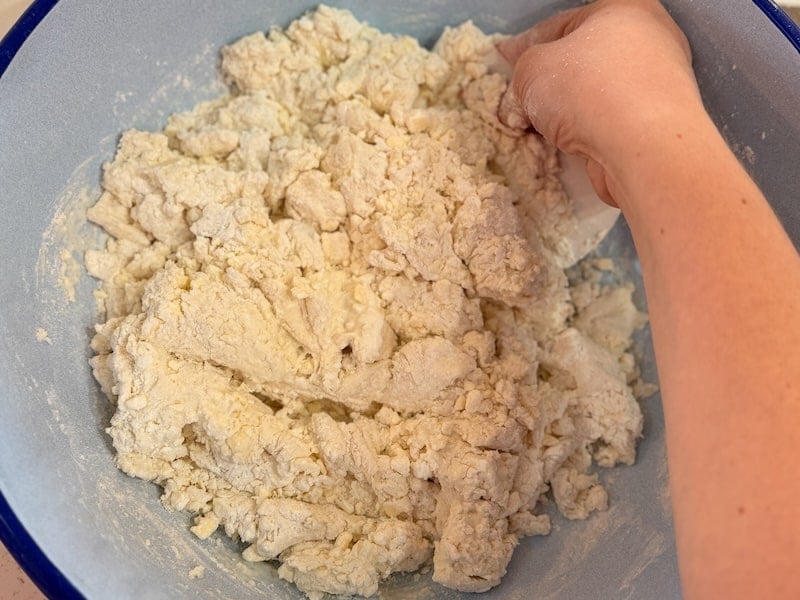 chopping up and mixing biscuit dough