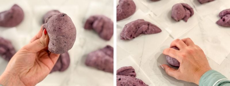 shaping each piece of blueberry bagel dough into a taut ball on individual parchment squares
