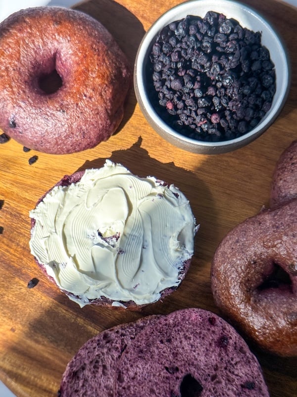 Chewy Blueberry Sourdough Bagels and a bowl of dried wild blueberries