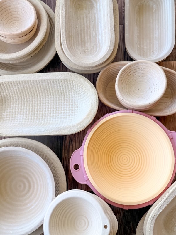 collection of bannetons in different shapes and material types