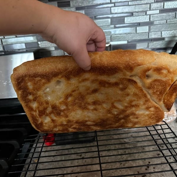 recipe tester michelle ann marie pyrex and parchment result showing a deeply browned bottom crust