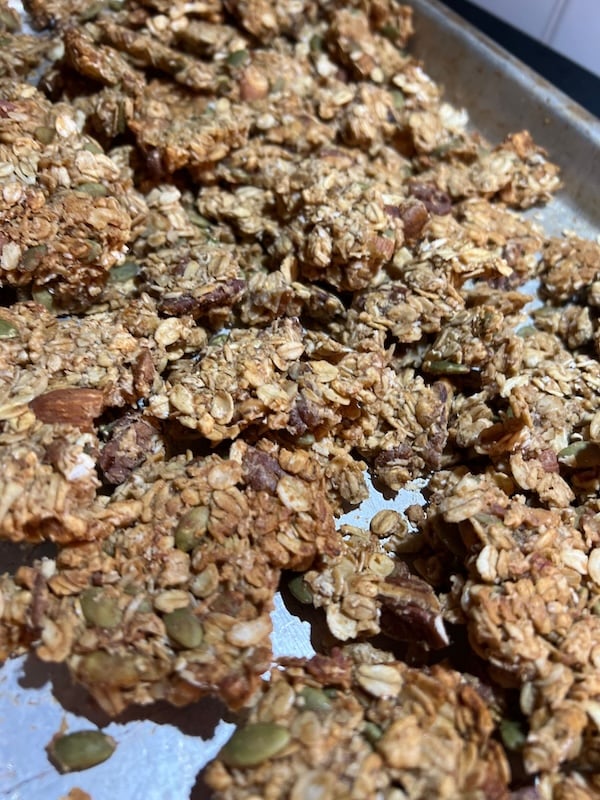 oats and honey sourdough discard granola with almonds and pumpkin seeds