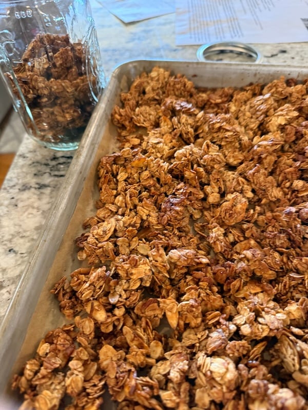 granola cooling on a sheet pan