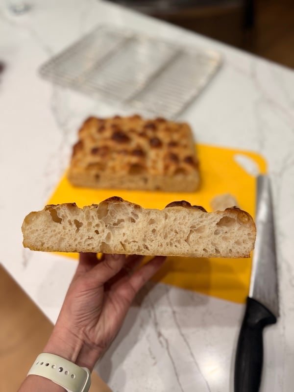 cross-section of recipe test 1 same day focaccia - a soft, moderately open crumb