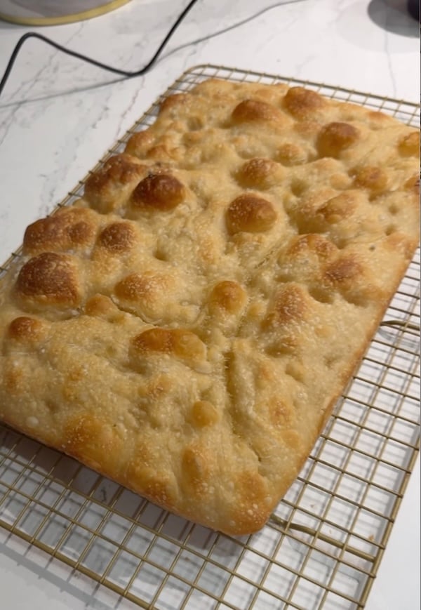 rectangular focaccia from round 3 of recipe test showing a lightly golden crust and shallow dimples