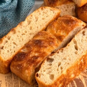 three thick slices of sourdough focaccia on paper