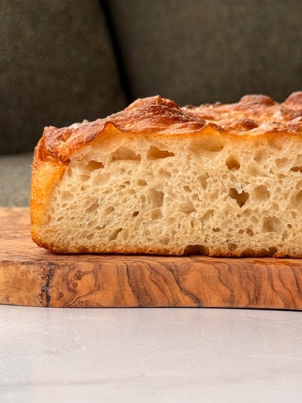 vertical view of the open airy crumb of this same day sourdough focaccia