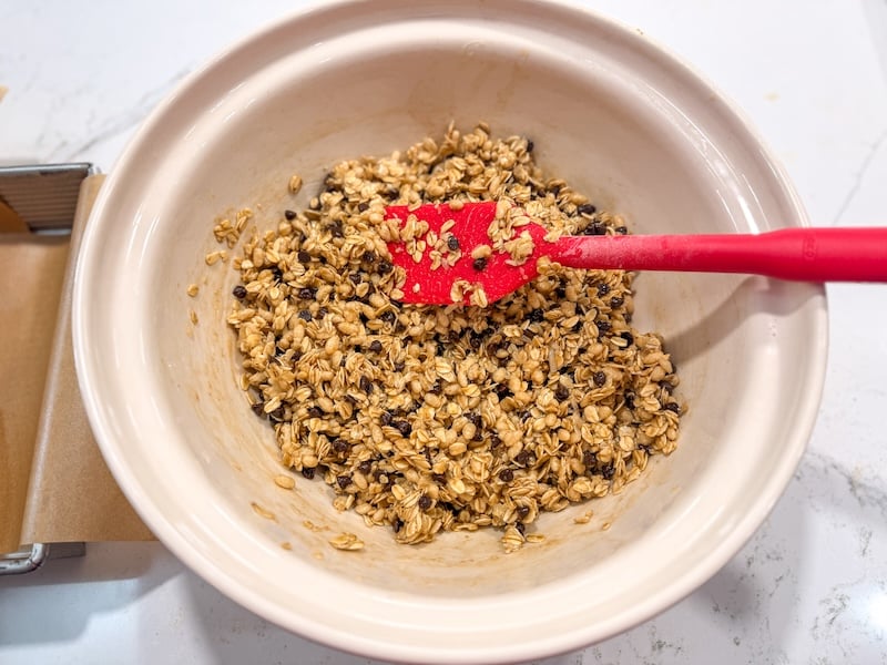 granola bar mixture with mini chocolate chips added