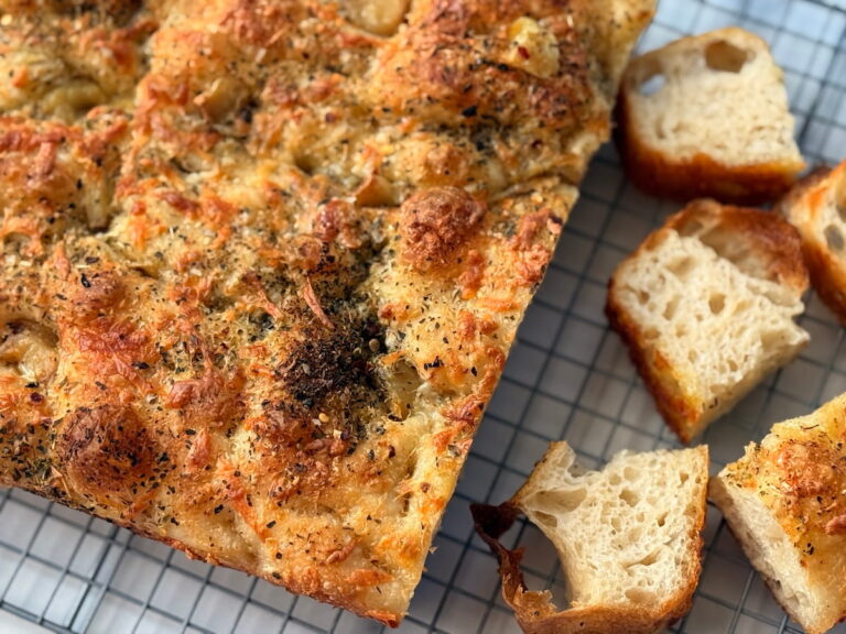 garlic and cheese sourdough focaccia on cooling rack