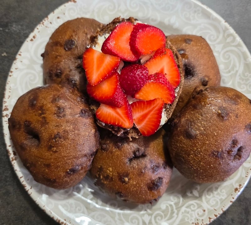 chocolate bagel with strawberries on top