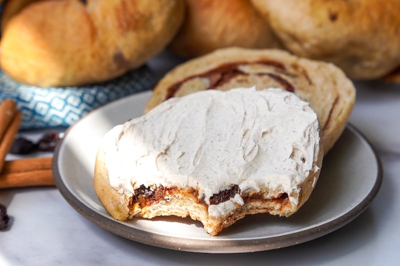 cinnamon raisin sourdough bagel with cream cheese on a plate