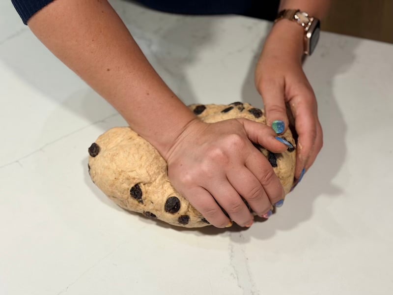 kneading cinnamon raisin bagel dough by hand to finish