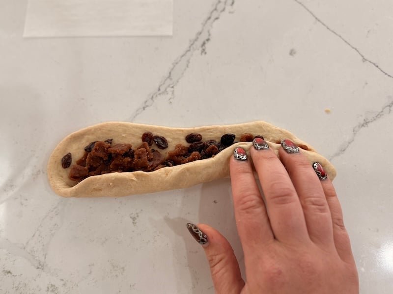rolling up frozen cinnamon bits bagel