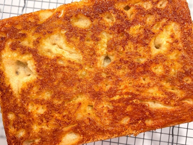 golden frico-like parmesan crust on the bottom of sourdough focaccia