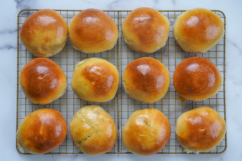 12 deep golden brown breakfast sourdough bierocks on a cooling rack