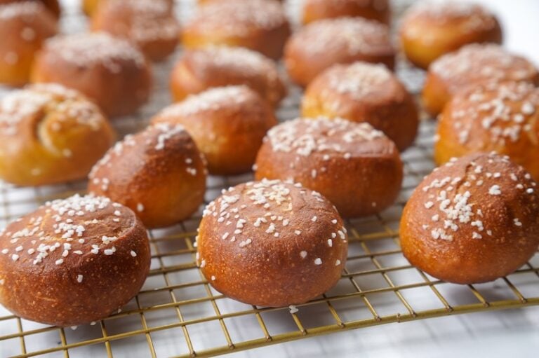 close up of soft sourdough pretzel bites on a cooling rack