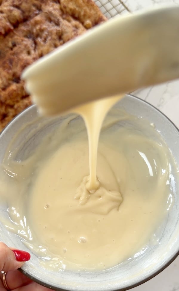 ready to top the focaccia with cream cheese drizzle
