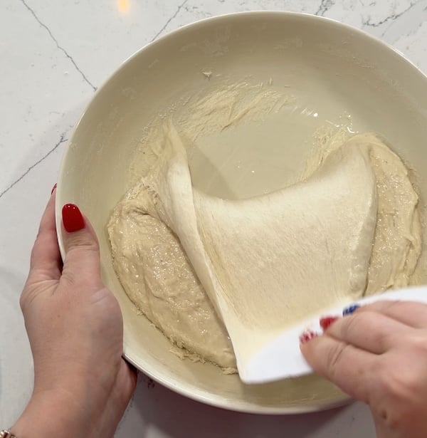 lifting and folding that dough over itself