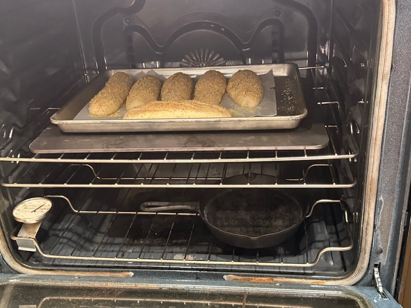 oven setup for hoagie rolls open baking with baking steel and cast iron pan on bottom rack