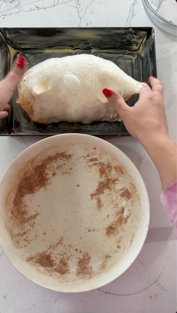 place marbled focaccia dough into buttered pan