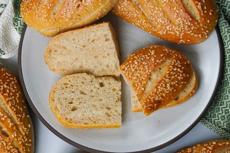 sliced open sourdough hoagie roll on a plate