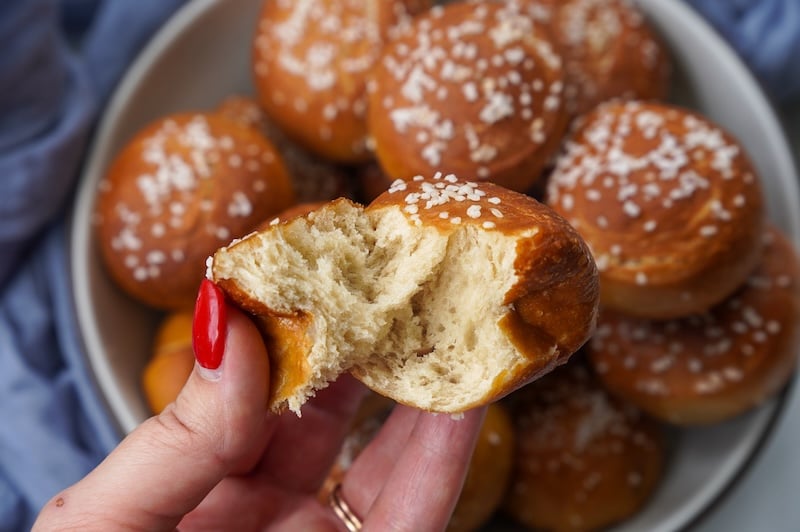 tearing open a sourdough pretzel bite