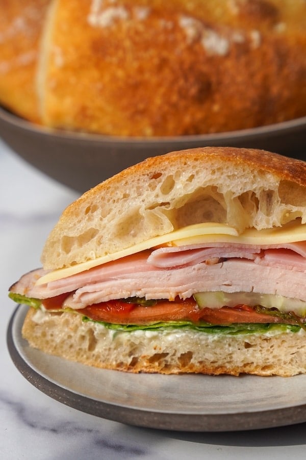 a lunchmeat sandwich on sourdough ciabatta