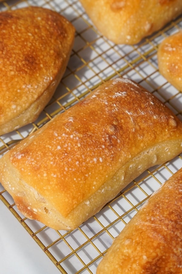 close up of a ciabatta roll on a cooling rack