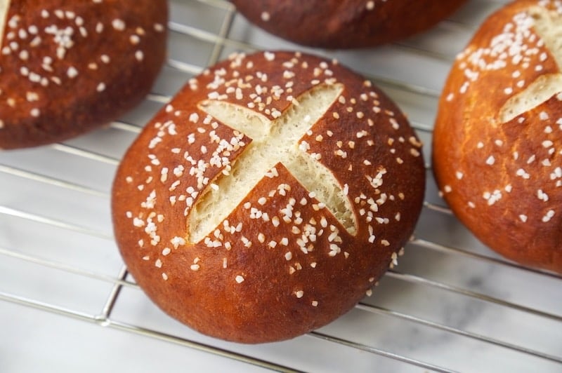 close up of scored pretzel bun