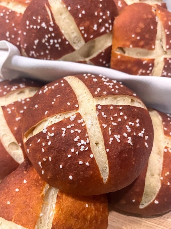 pretzel buns on a kitchen towel