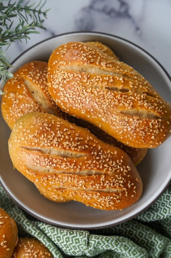 sourdough hoagie rolls in a bowl