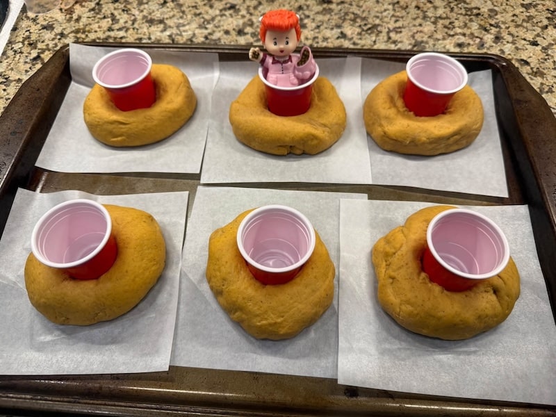 Lisa M bagels with red solo shot cup in the middles to keep the hole open