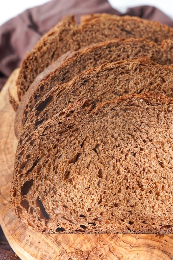 sliced sourdough brown bread on a cutting board