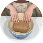 stretch and folding brown bread dough