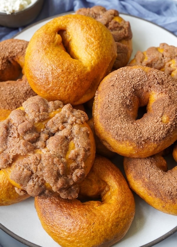 Pumpkin sourdough bagels with three topping options: plain, cinnamon sugar, and pumpkin spice crunch.