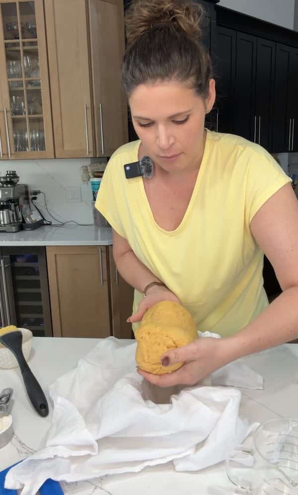 place dough in a towel and flour lined banneton