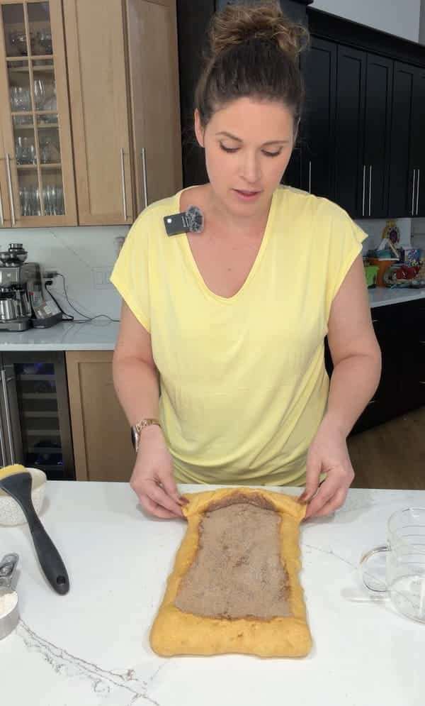 start rolling up the dough log