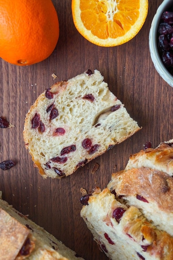 top down view of a slice of orange cranberry bread