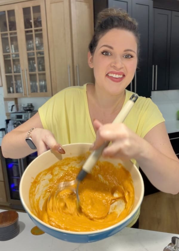 using a danish dough whisk to mix the pumpkin dough